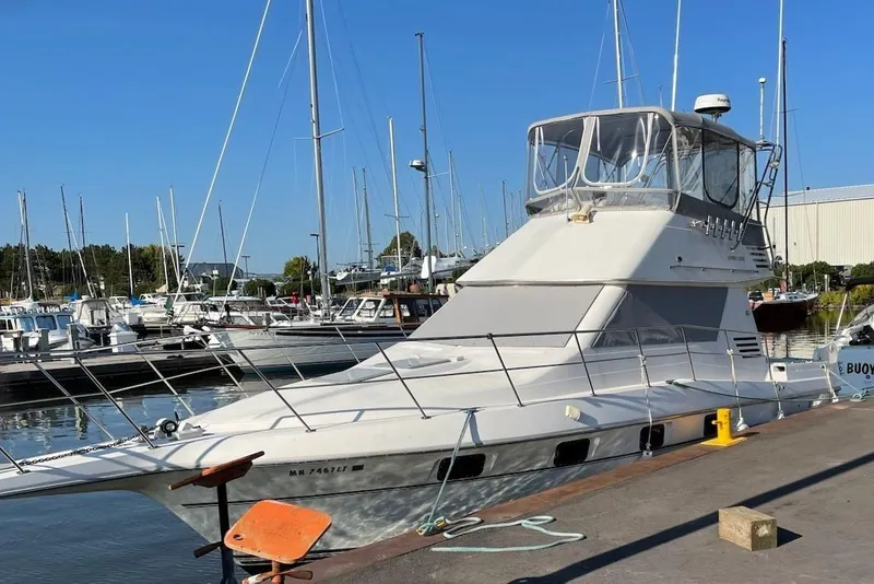 Slide: The Image of 1994 Cruisers Yachts 3380 Esprit docked on a sunny day. - 2