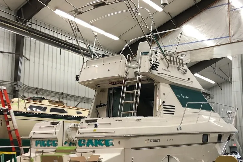 Slide: The Image of 1994 Cruisers Yachts 3380 Esprit in a boat storage facility. - 5