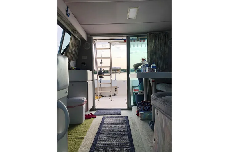 Slide: The Image of Interior view of 1994 Cruisers Yachts 3380 Esprit, featuring cozy cabin and open deck access. - 6