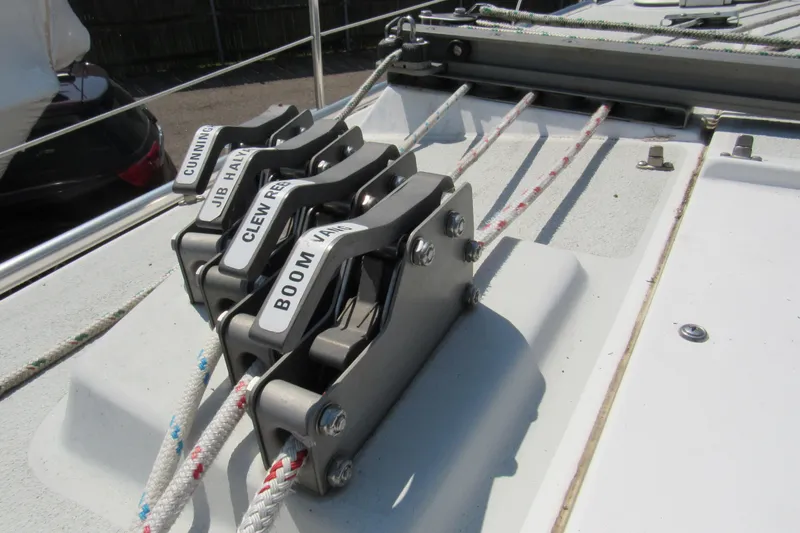 Slide: The Image of Deck hardware on a 1997 Catalina 28 MkII sailboat, featuring labeled rope clutches. - 6