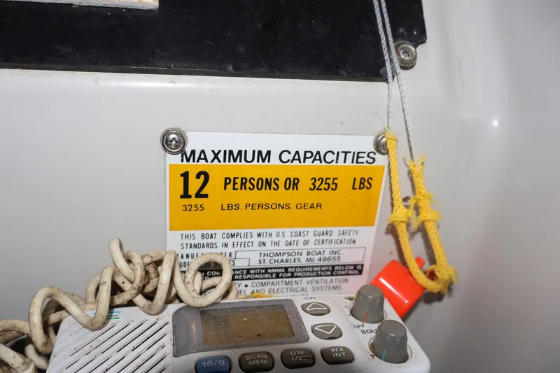 Slide: The Image of 1990 Thompson 250 Daytona Mid Cabin capacity label, 12 persons or 3255 lbs. - 28