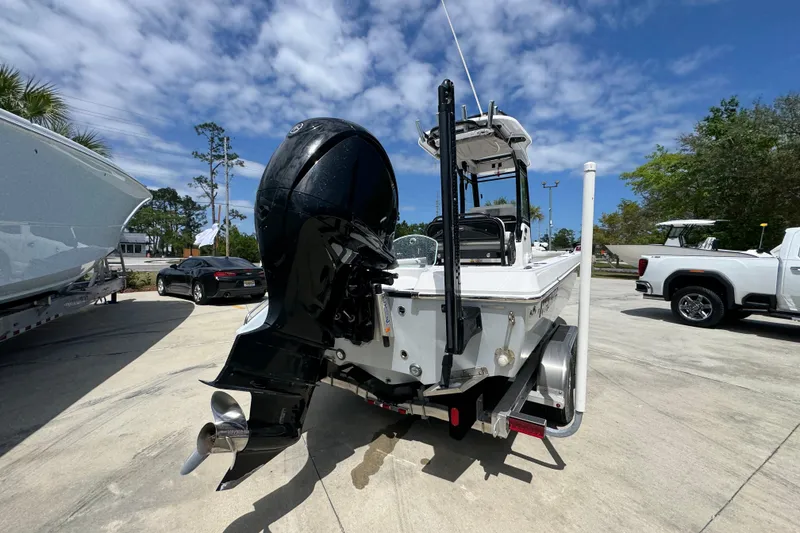Slide: The Image of 2022 Everglades 243 Center Console boat with powerful outboard motor on trailer. - 11