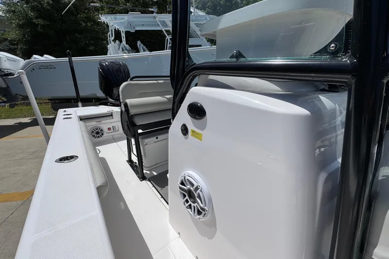 Slide: The Image of 2022 Everglades 243 Center Console boat interior with seating and speaker system. - 22