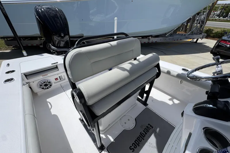 Slide: The Image of 2022 Everglades 243 Center Console boat interior with seating and steering wheel. - 25