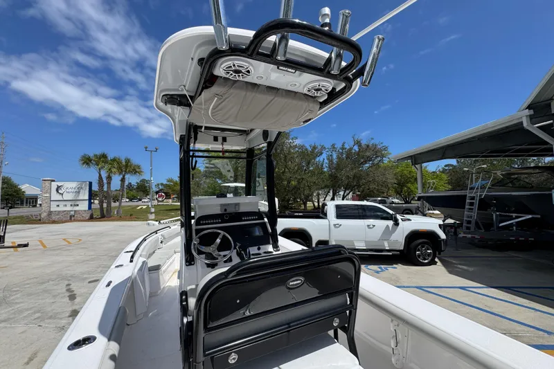Slide: The Image of 2022 Everglades 243 Center Console boat at marina with clear blue sky. - 34