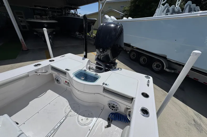 Slide: The Image of 2022 Everglades 243 Center Console boat with motor, docked in a marina. - 36