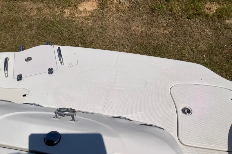 Slide: The Image of Rear deck of a 2011 Tahoe 225 boat on grass. - 11