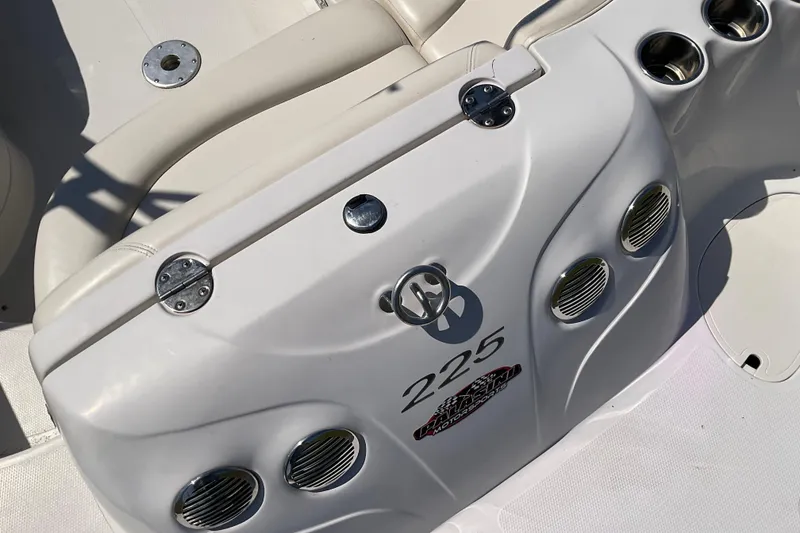 Slide: The Image of 2011 Tahoe 225 boat interior with cup holders and ventilation grilles. - 8