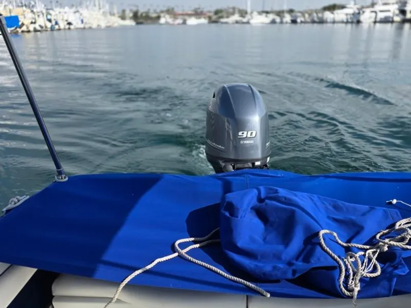 Slide: The Image of 1995 Sea Ray 19 Open Bow with Yamaha 90 HP engine on calm water. - 11