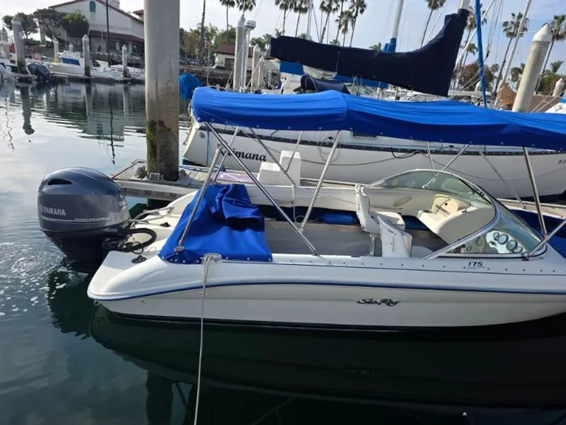 Slide: The Image of 1995 Sea Ray 19 Open Bow boat docked in marina. - 13