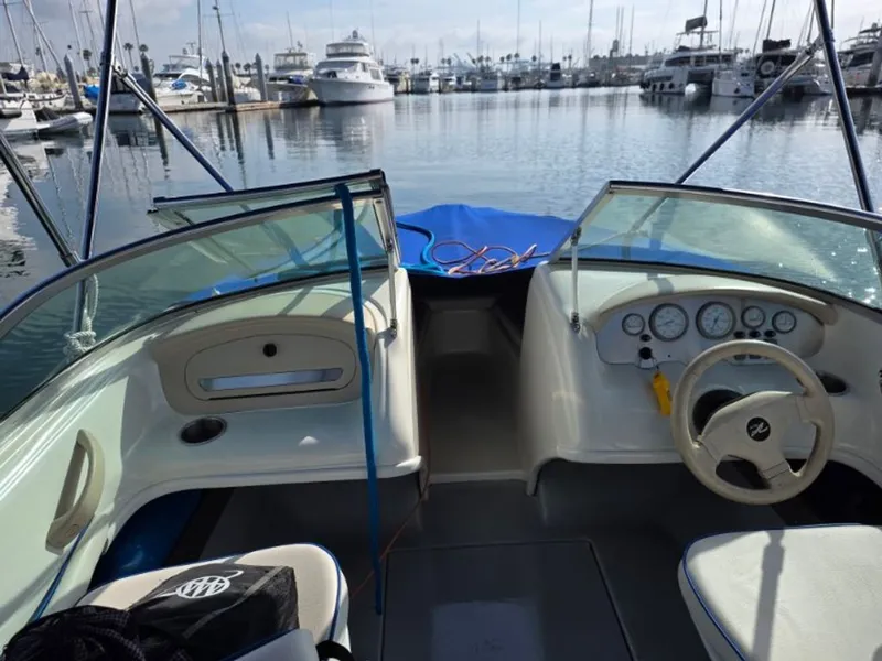 Slide: The Image of Interior view of a 1995 Sea Ray 19 Open Bow boat in harbor. - 4