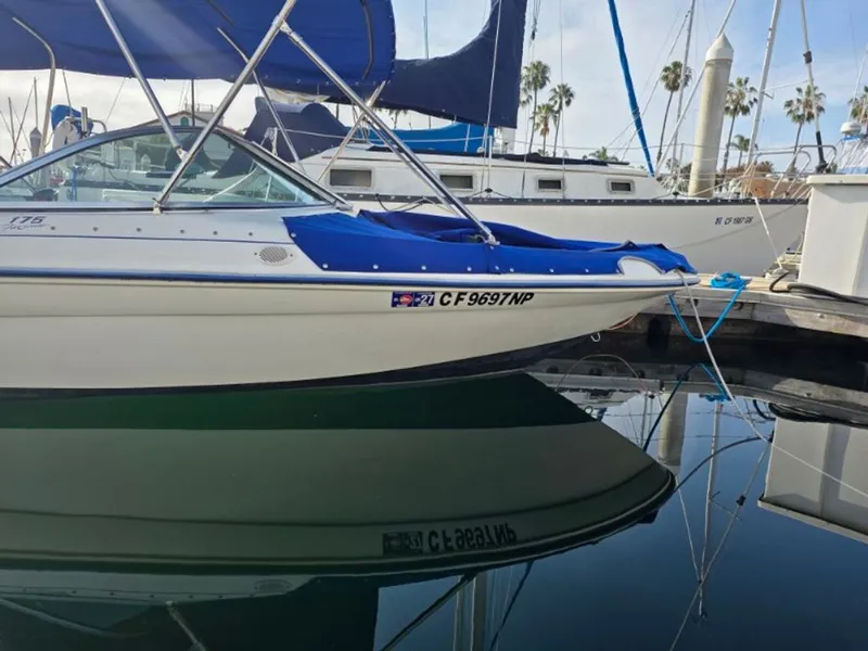 Slide: The Image of 1995 Sea Ray 19 Open Bow boat docked in harbor. - 5