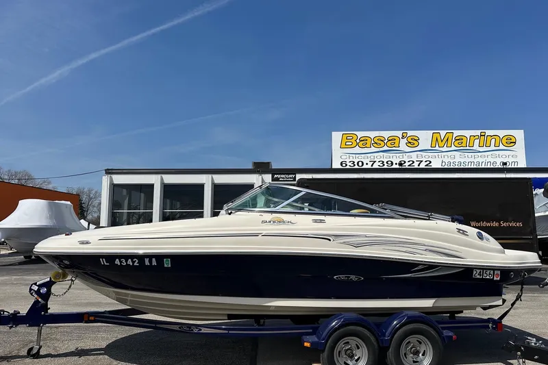 The Image of 2005 Sea Ray 200 Sundeck boat on trailer at Basa's Marine dealership. - 0