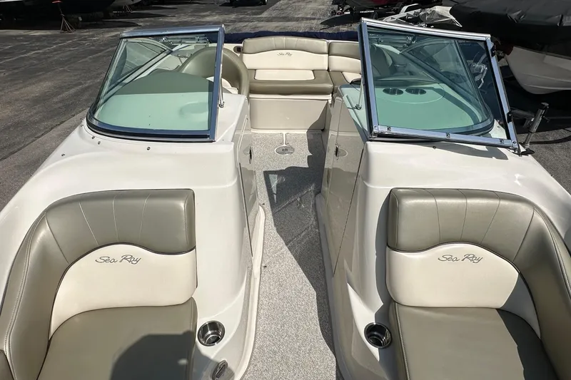 Slide: The Image of 2005 Sea Ray 200 Sundeck boat interior with seating and windshield. - 4