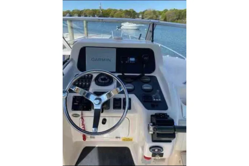 Slide: The Image of Helm of 2004 Grady-White Express 265 boat with Garmin navigation system. - 3