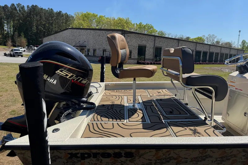 Slide: The Image of 2026 Xpress H20B Bay boat with Yamaha engine, featuring stylish seating and modern design. - 10