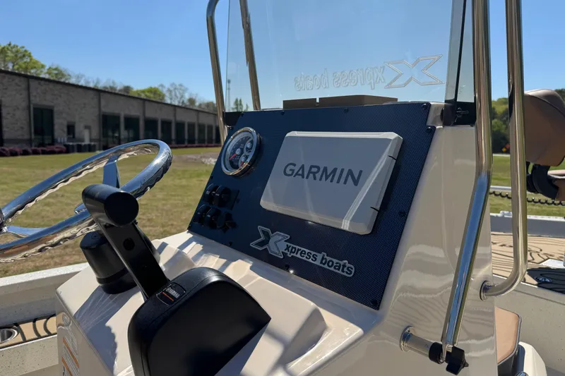 Slide: The Image of 2026 Xpress H20B Bay boat dashboard with Garmin navigation system. - 12