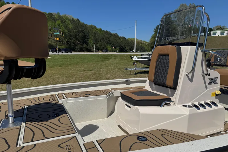 Slide: The Image of 2026 Xpress H20B Bay boat interior with tan seating and sleek design. - 5