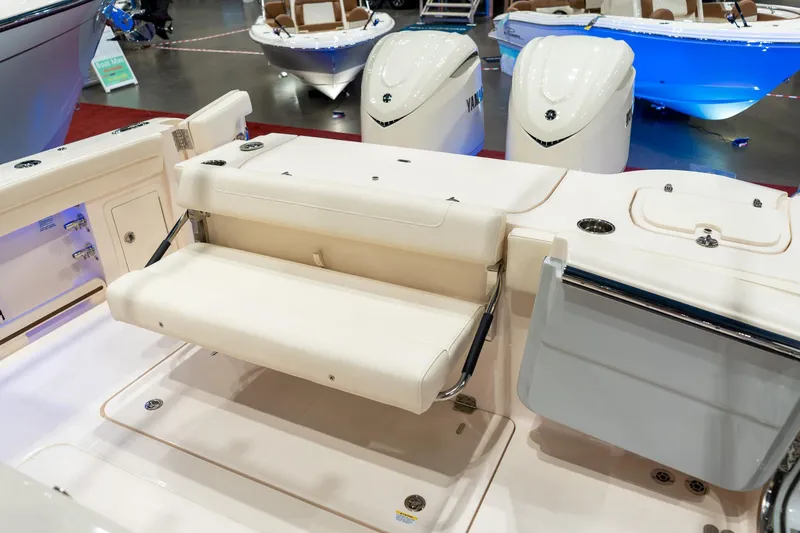 Slide: The Image of 2026 Grady-White Canyon 326 boat interior with foldable seating and Yamaha engines. - 10