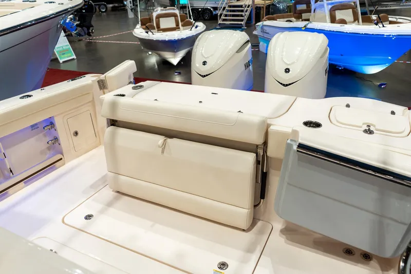 Slide: The Image of 2026 Grady-White Canyon 326 boat interior with Yamaha engines at a showroom display. - 11