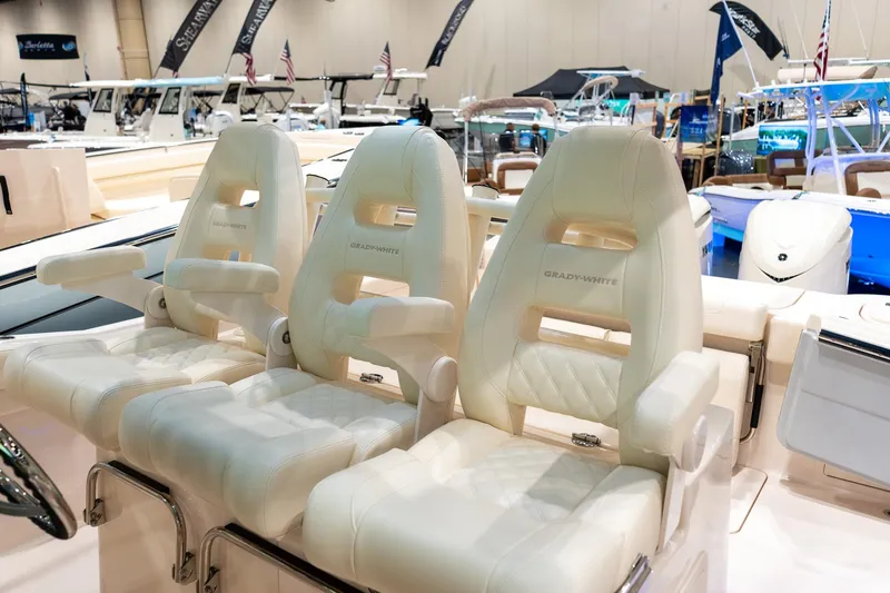 Slide: The Image of Luxury seating on 2026 Grady-White Canyon 326 boat at a marine exhibition. - 17