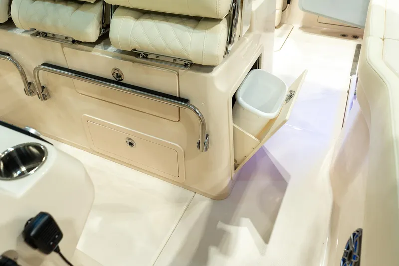 Slide: The Image of 2026 Grady-White Canyon 326 boat interior with storage and seating features. - 18
