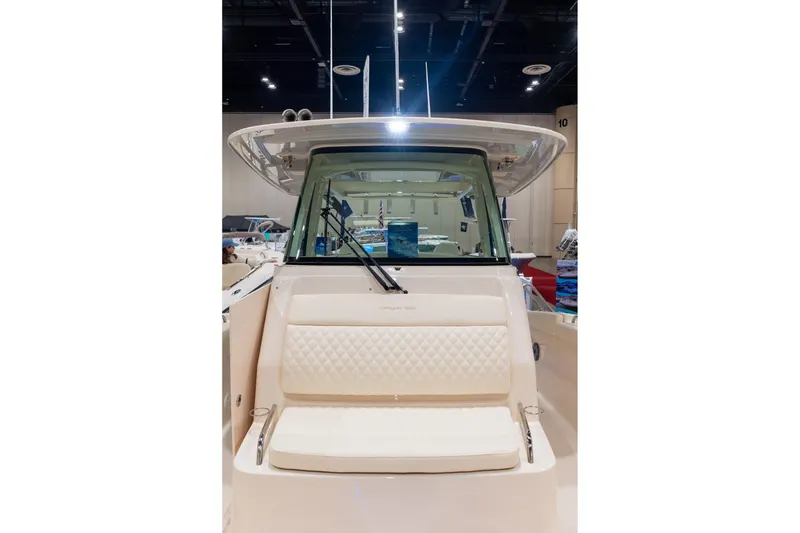 Slide: The Image of 2026 Grady-White Canyon 326 boat interior with cushioned seating and windshield. - 20