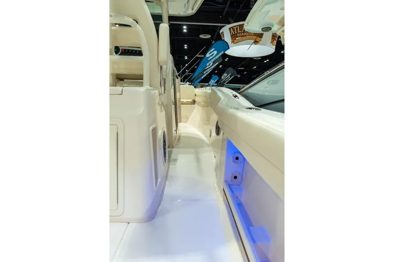 Slide: The Image of 2026 Grady-White Canyon 326 boat interior with sleek design and ambient lighting. - 26