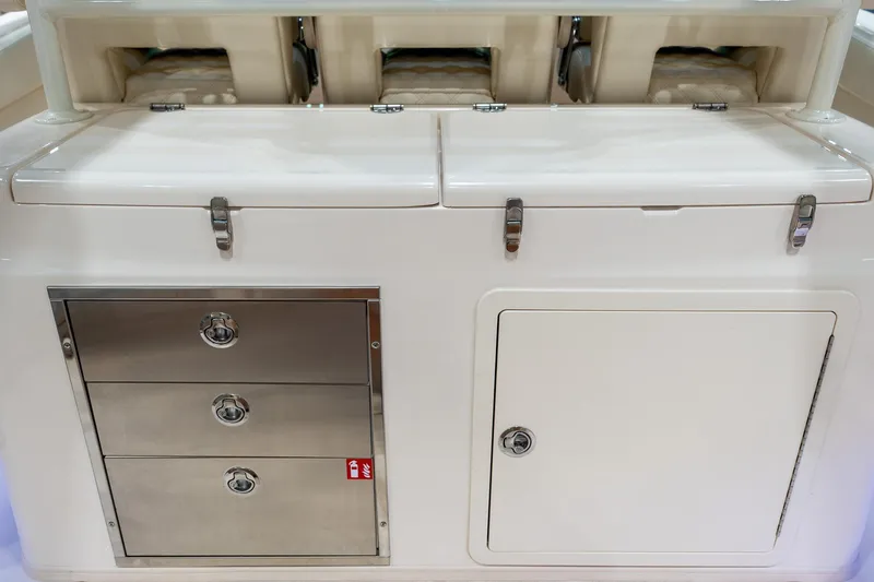 Slide: The Image of 2026 Grady-White Canyon 326 boat storage compartments and drawers, showcasing sleek design and functionality. - 7