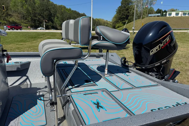 Slide: The Image of 2025 Xpress H20B Bay boat with seating and powerful outboard motor. - 9