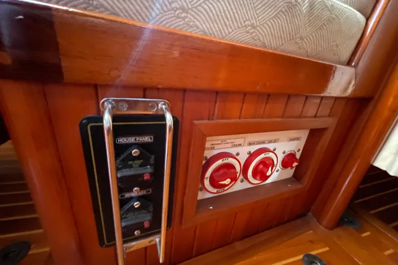 Slide: The Image of Control panel on 1981 Hans Christian MKII yacht with wooden finish and red switches. - 12