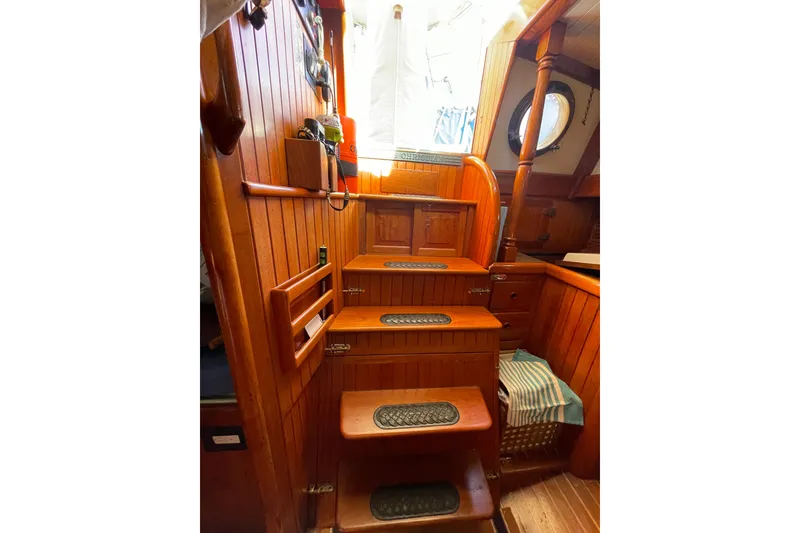 Slide: The Image of Interior of 1981 Hans Christian MKII sailboat with wooden stairs and nautical decor. - 15