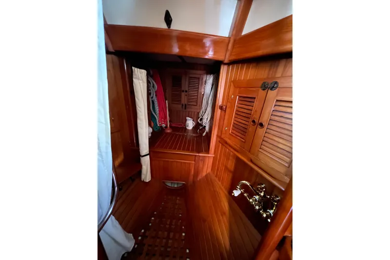 Slide: The Image of Interior of 1981 Hans Christian MKII sailboat with wooden finish and nautical decor. - 20