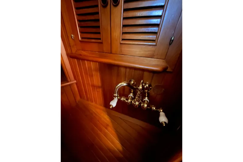 Slide: The Image of Wooden interior of 1981 Hans Christian MKII with vintage brass faucet. - 21