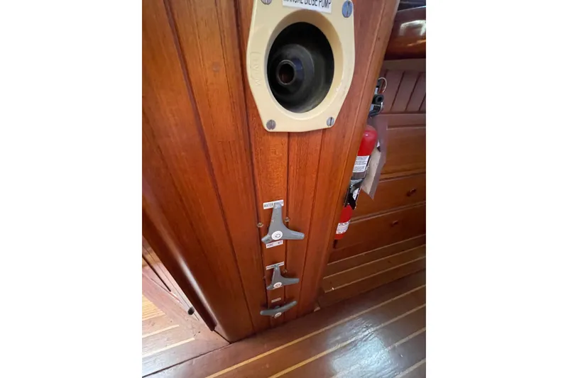 Slide: The Image of 1981 Hans Christian MKII interior with manual bilge pump and fire extinguisher. - 24