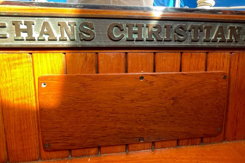 Slide: The Image of 1981 Hans Christian MKII boat with wooden paneling and engraved nameplate. - 32