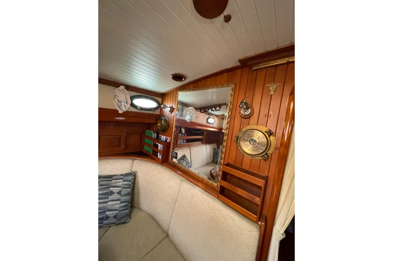 Slide: The Image of Interior of 1981 Hans Christian MKII sailboat with wooden paneling and nautical decor. - 4