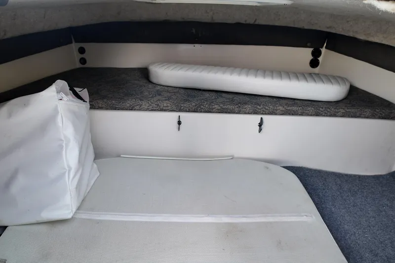 Slide: The Image of 2003 Pro Sports 2860 SC ProKat cabin interior with cushions and storage. - 10