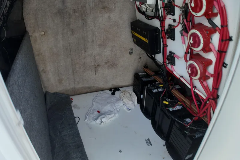 Slide: The Image of Electrical compartment of 2003 Pro Sports 2860 SC ProKat boat with batteries and wiring. - 16