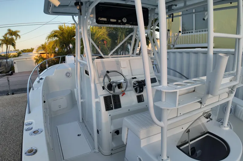 Slide: The Image of 2003 Pro Sports 2860 SC ProKat boat interior with steering wheel and seating. - 5