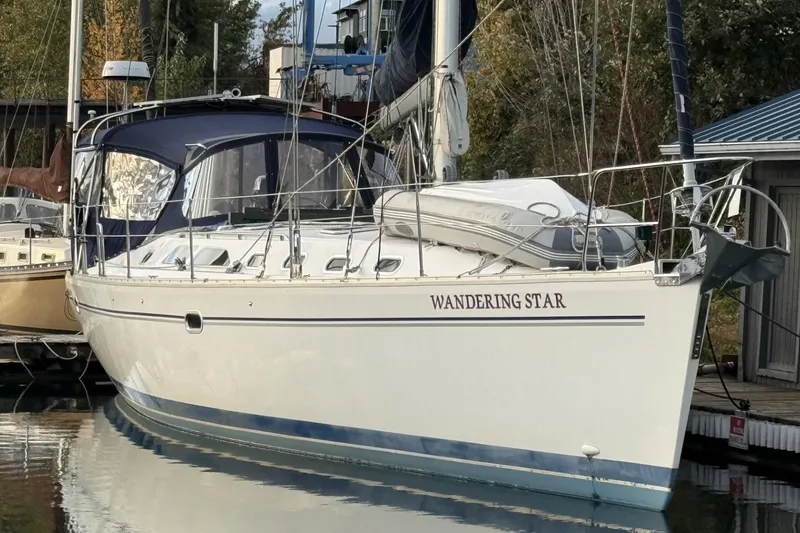 The Image of Catalina 470 sailboat "Wandering Star" docked, 2004 model, with blue canopy. - 0