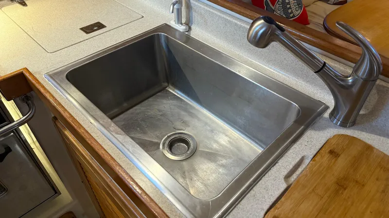 Slide: The Image of Stainless steel sink and faucet in 2004 Catalina 470 yacht kitchen. - 16