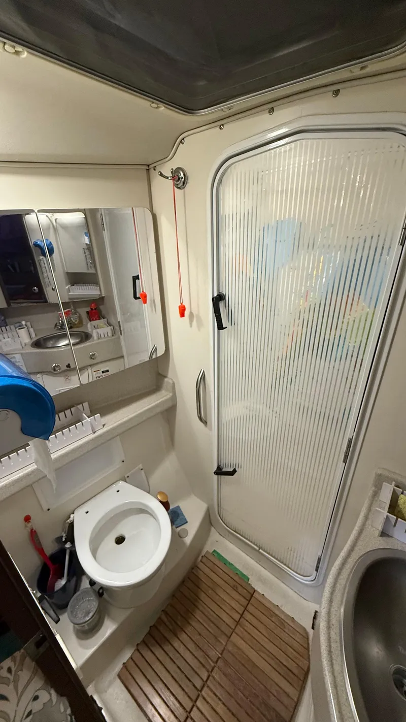 Slide: The Image of 2004 Catalina 470 yacht bathroom with shower, sink, and mirror. - 18