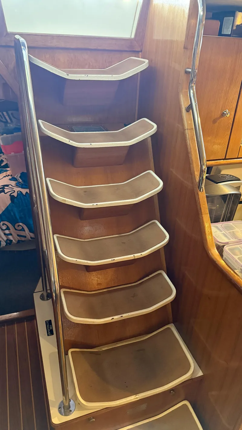 Slide: The Image of Wooden interior stairs on a 2004 Catalina 470 yacht. - 23