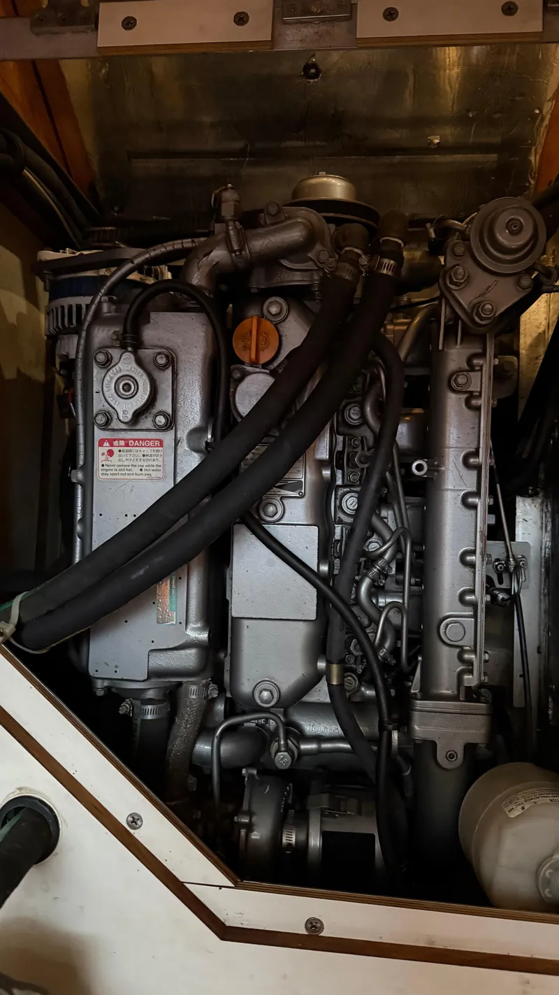 Slide: The Image of Engine compartment of a 2004 Catalina 470 sailboat, showcasing detailed mechanical components. - 25