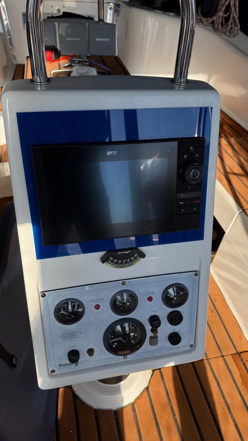 Slide: The Image of Control panel of a 2004 Catalina 470 sailboat with navigation instruments. - 32