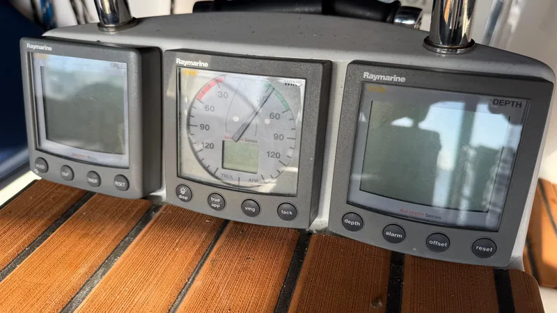 Slide: The Image of Raymarine navigation instruments on a 2004 Catalina 470 yacht dashboard. - 35