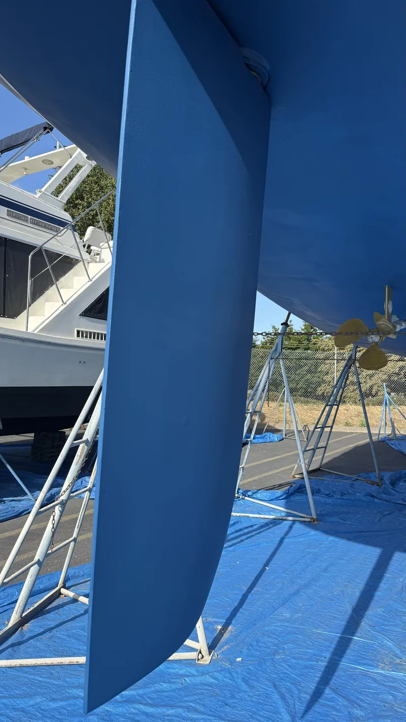 Slide: The Image of Catalina 470 sailboat keel and propeller, 2004 model, on stands for maintenance. - 46