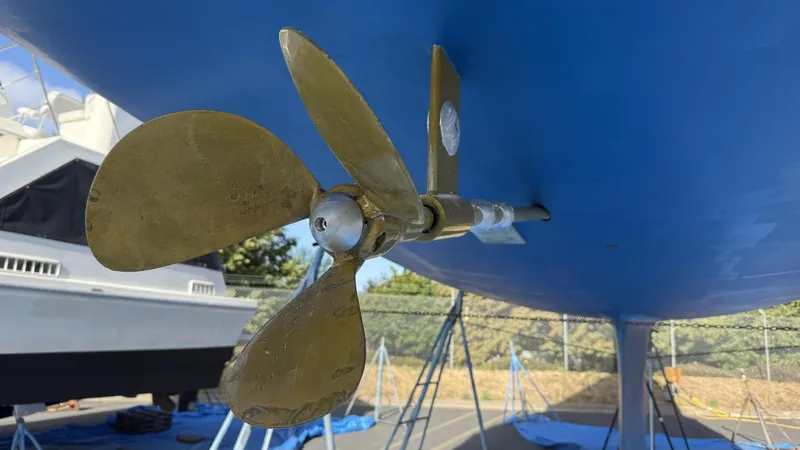 Slide: The Image of Close-up of a 2004 Catalina 470 sailboat propeller, displayed on a stand. - 47