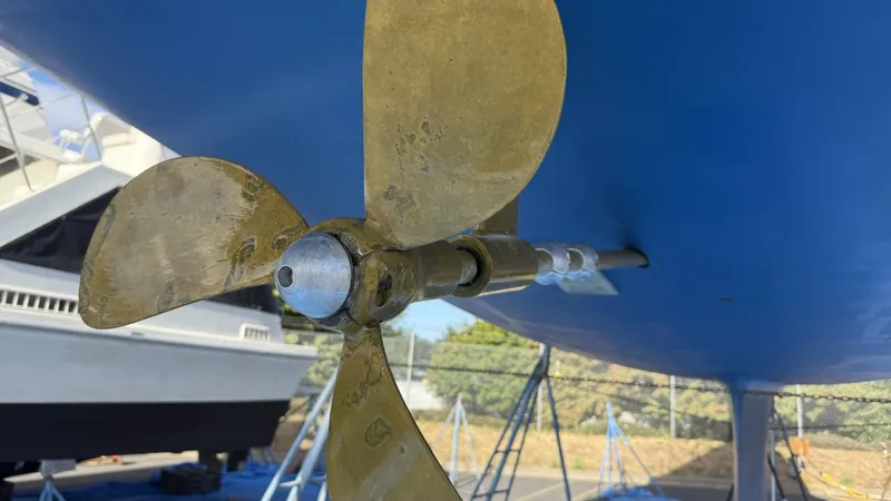 Slide: The Image of Close-up of a Catalina 470 sailboat propeller, 2004 model, on a blue hull. - 48